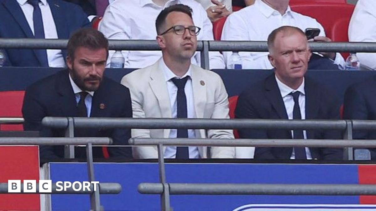 Salford co-owner David Beckham (left) and football director Paul Scholes sit either side of chief executive Gavin Fleig at Wembley