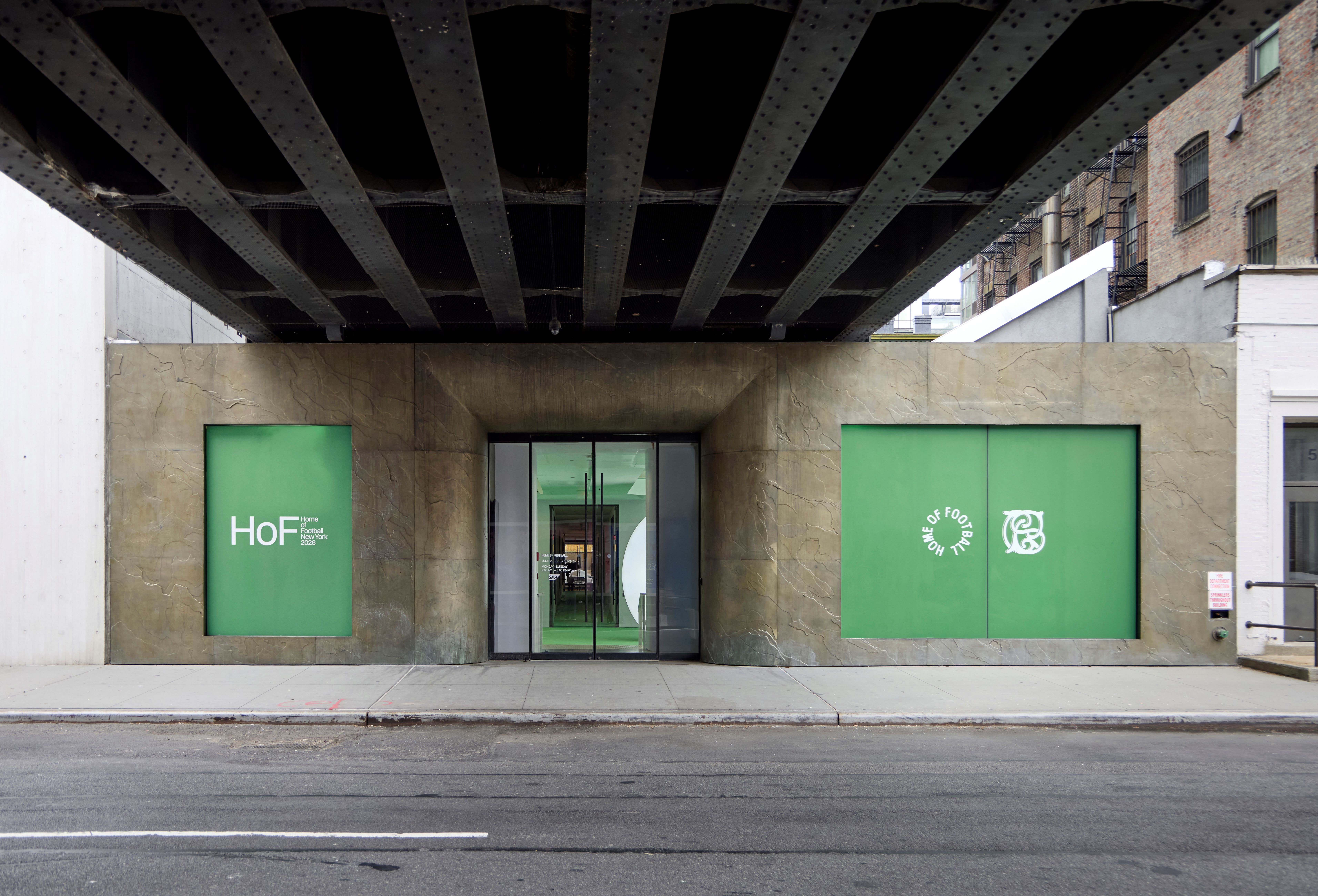 Exterior of Home of Football: Home &amp; Away exhibition space in New York, with green football pitch-inspired doors