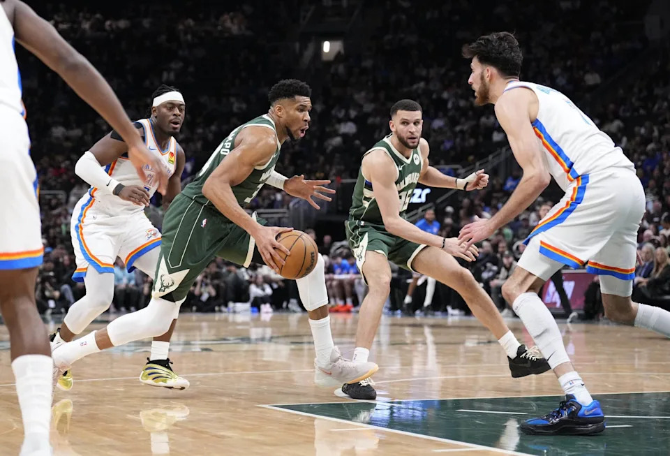Jan 21, 2026; Milwaukee, Wisconsin, USA; Milwaukee Bucks forward Giannis Antetokounmpo (34) drives to the basket against Oklahoma City Thunder center/forward Chet Holmgren (7) in the first half at Fiserv Forum. Mandatory Credit: Michael McLoone-Imagn Images