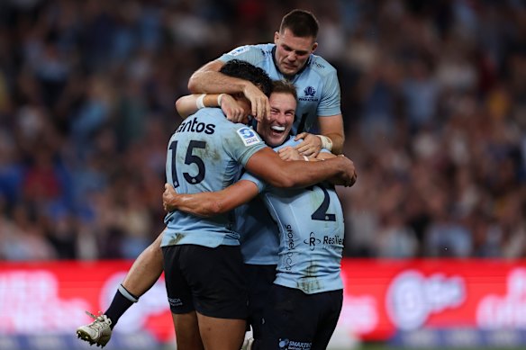 Joseph-Aukuso Suaalii, Jack Bowen and Henry O’Donnell of the Waratahs celebrate a victory last year.