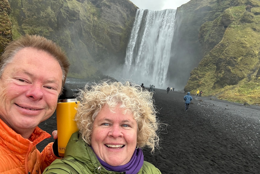 Peter and Christine Kernke in front of a waterfall