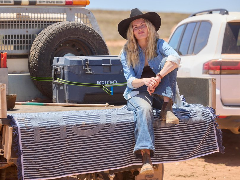 Home And Away star Bonnie Sveen takes a load off between takes at Bullara Station, outside of Exmouth.