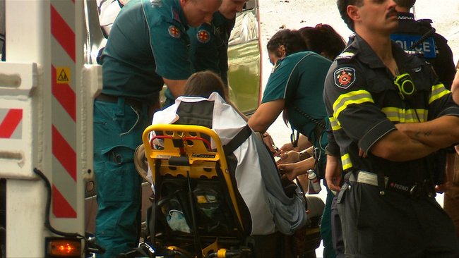 Paramedics assessed the protester after she was brought safely to the ground.
