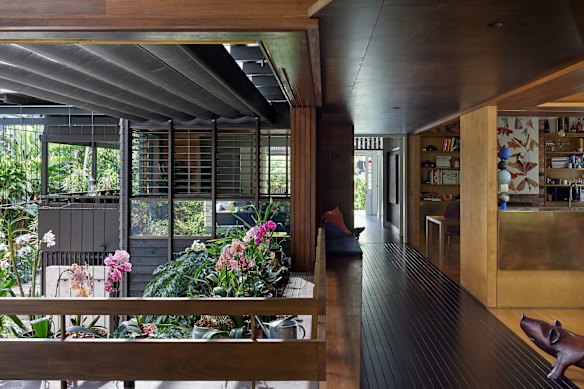 This middle portion of the house creates a dramatic, north-facing double-height garden court.