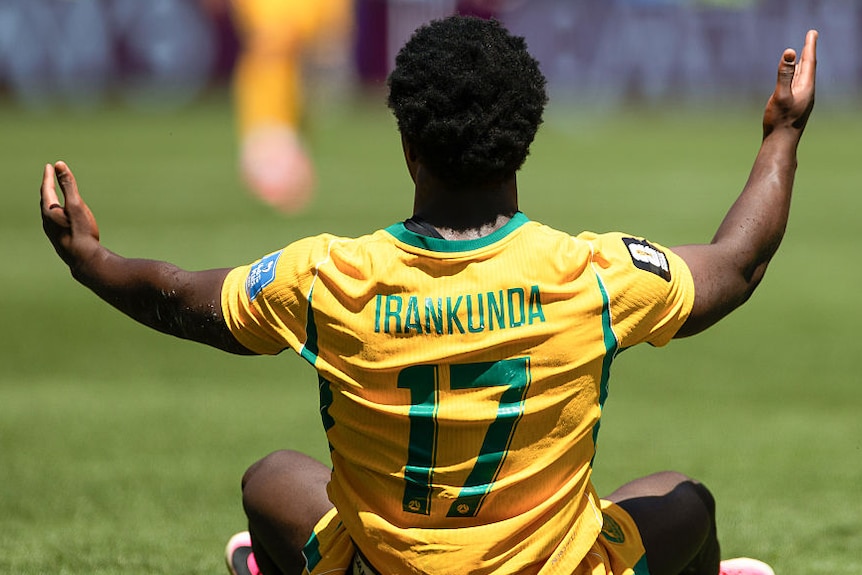 Nestory Irankuna holds out his hands