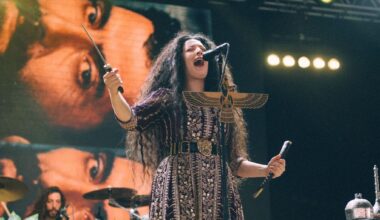 Nina Saeidi with a sword on stage