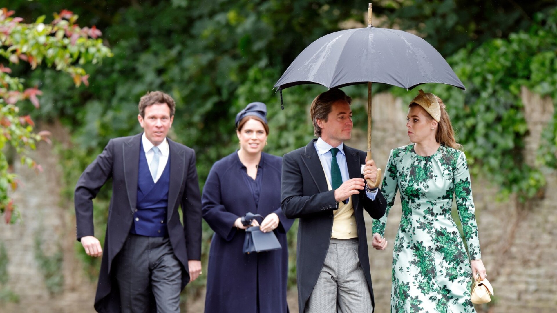 Princesses Beatrice and Eugenie come out of hiding to make ‘tense’ appearance at Royal wedding