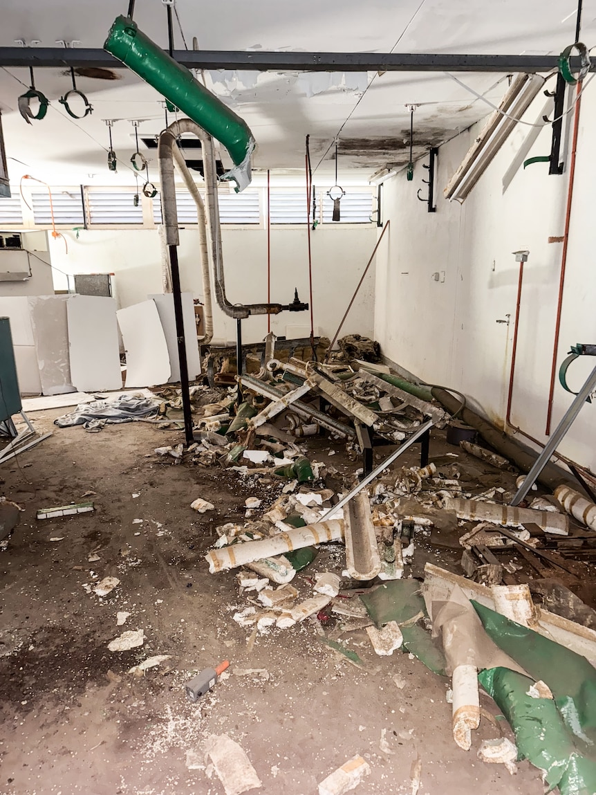 demolition site with asbestos material exposed after copper thefts