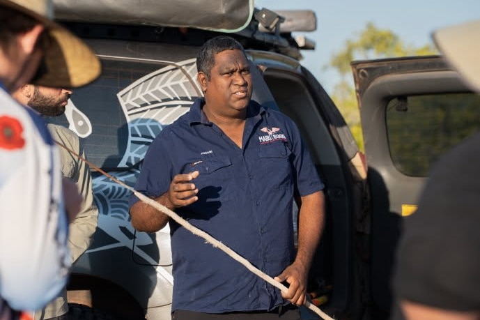 A man in a navy shirt.