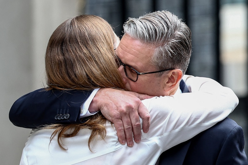 British Prime Minister Keir Starmer hugs his wife Victoria
