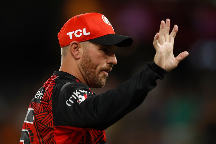 Aaron Finch of the Melbourne Renegades waves during a BBL game.