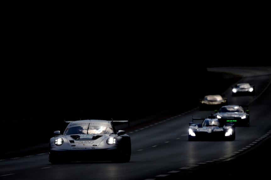 GT3 cars at the Le Mans 24hr preview, driving in the evening down the long straight