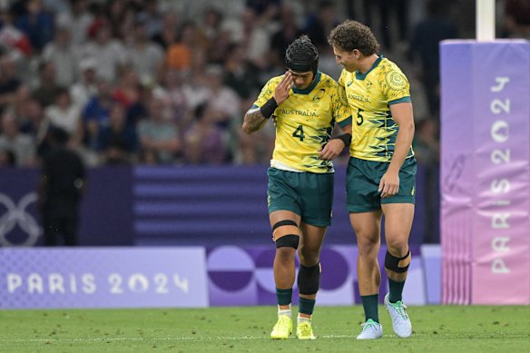 Dietrich Roache (left) and Mark Nawaqanitawase celebrate an Australian Sevens win at the Paris Olympics.