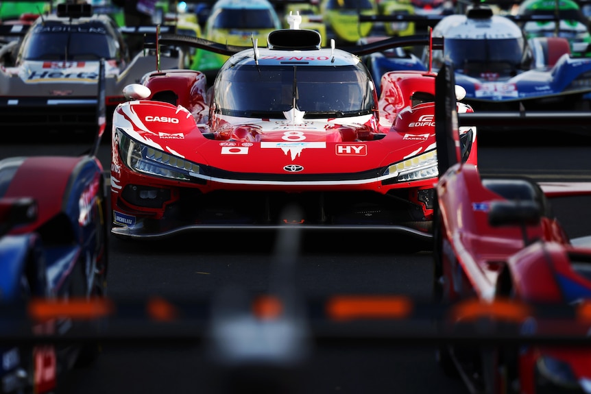 Endurance racing cars lined up on the grid for a promotional photograph