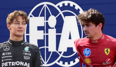George Russell and Charles Leclerc look concerned at one another in front of the FIA logo