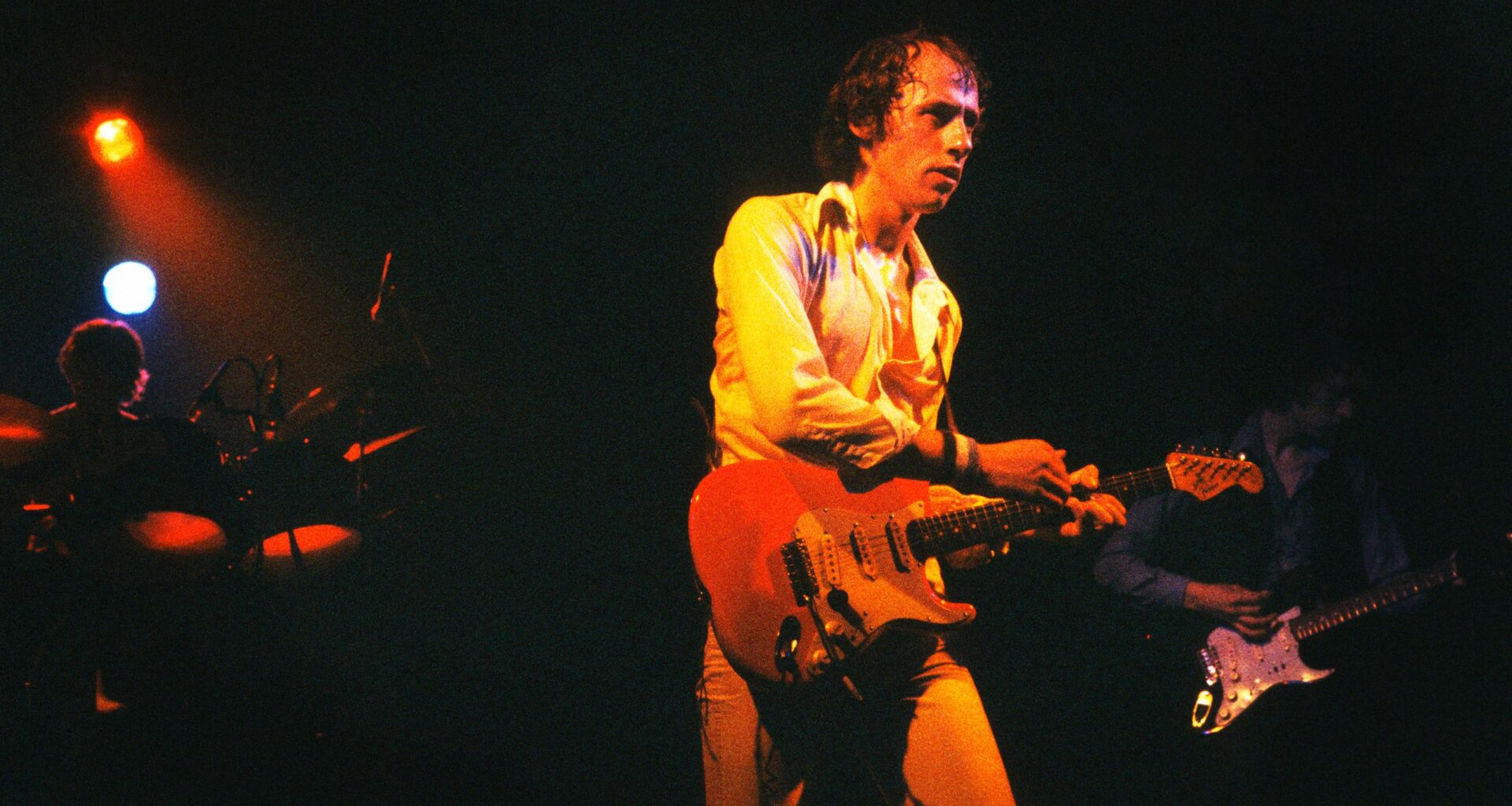 “I said, ‘You’ve got to be joking! You can’t put out a record about a trad band playing in a pub and expect it to sell!’": the story of the classic Dire Straits song that's often imitated, but rarely mastered