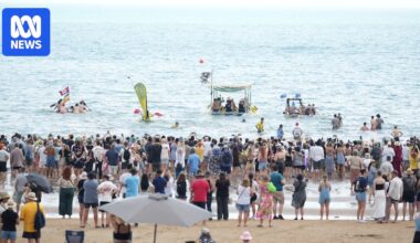 Thousands gather for iconic Beer Can Regatta at Darwin's Mindil Beach
