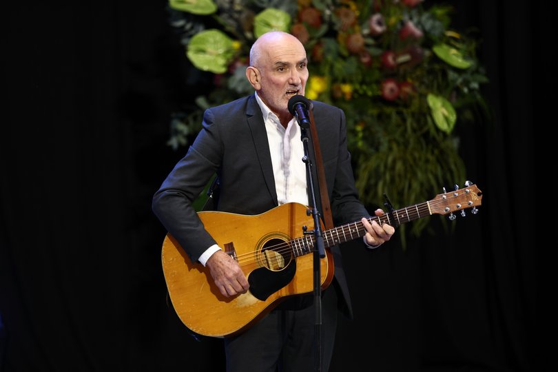 Paul Kelly performs,
