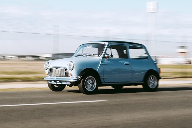 Blue small car on the road
