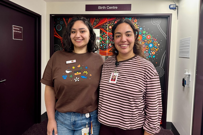 Two smiling midwives