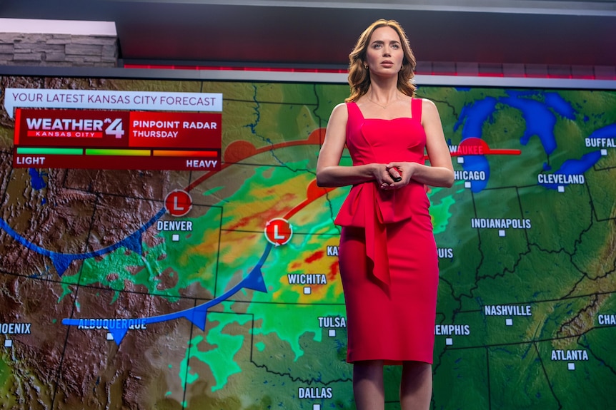 A woman presents the weather.