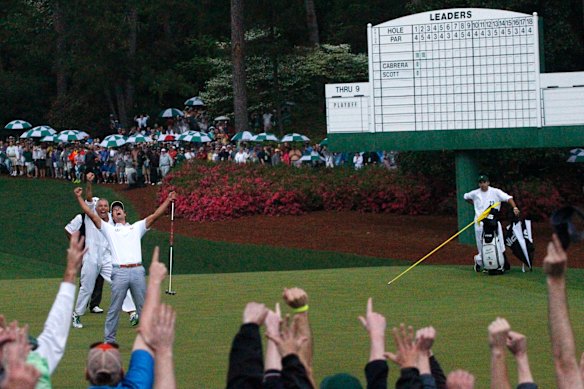 Scott celebrates after holing the winning putt at Augusta in 2013.