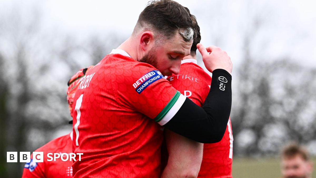 Joe Baldwin and Lloyd Roby of North Wales Crusaders embrace