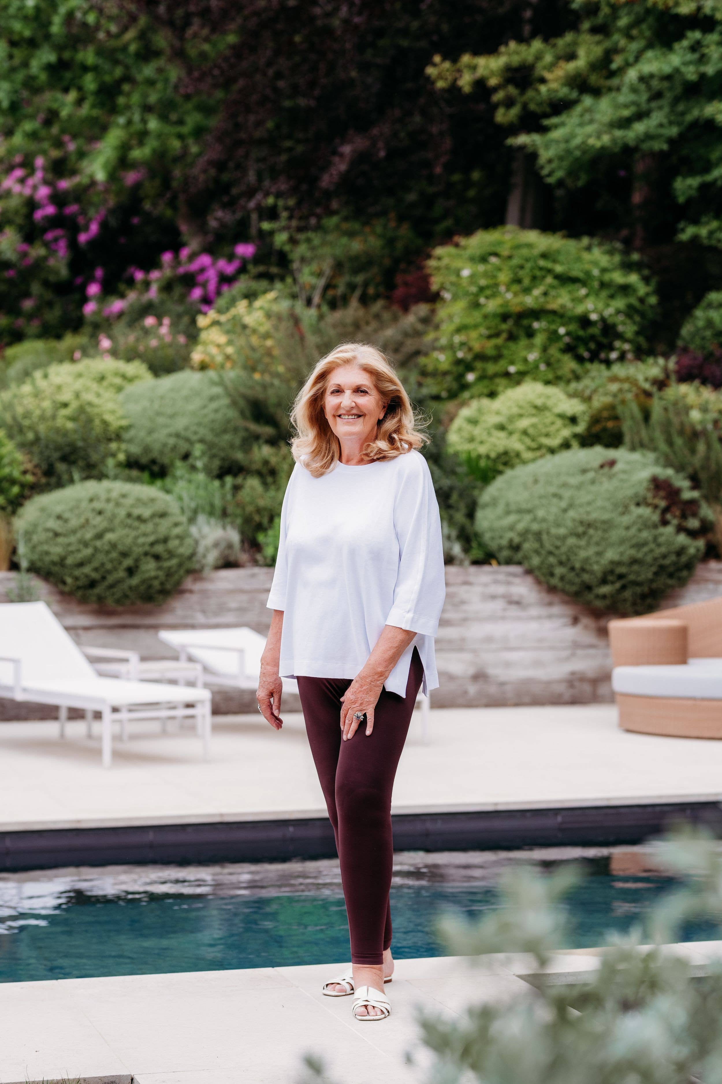 older woman by her pool