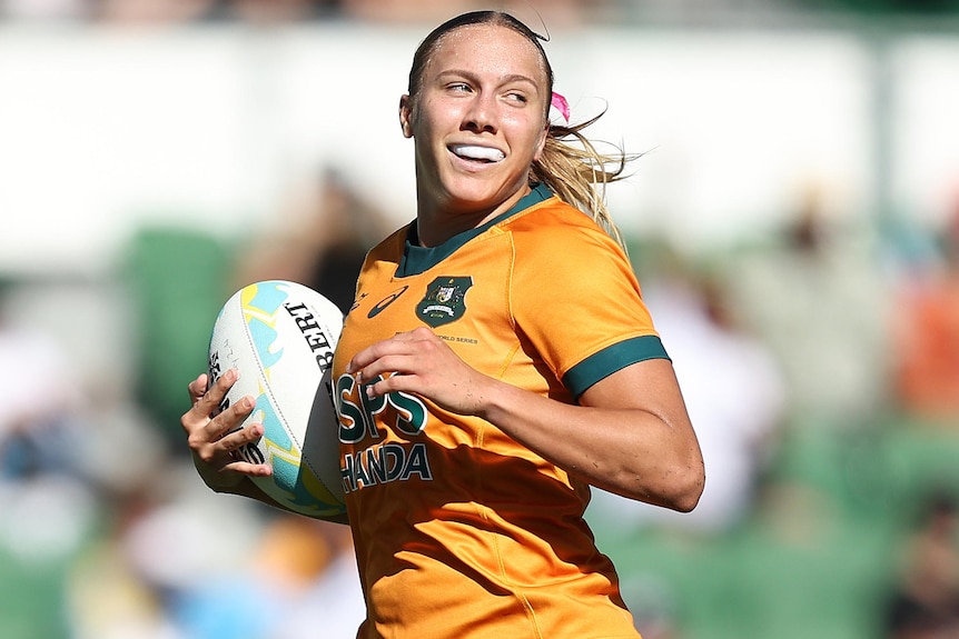Teagan Levi scores a try for Australia during a rugby sevens tournament.