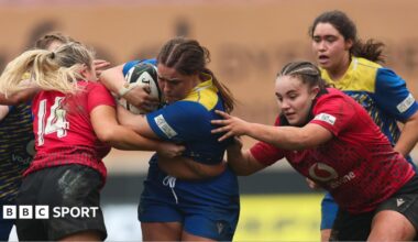 Chloe Thomas Bradley of Gwalia Lightning takes on Mabli Evans of Brython Thunder and Lucy Isaac of Brython Thunder