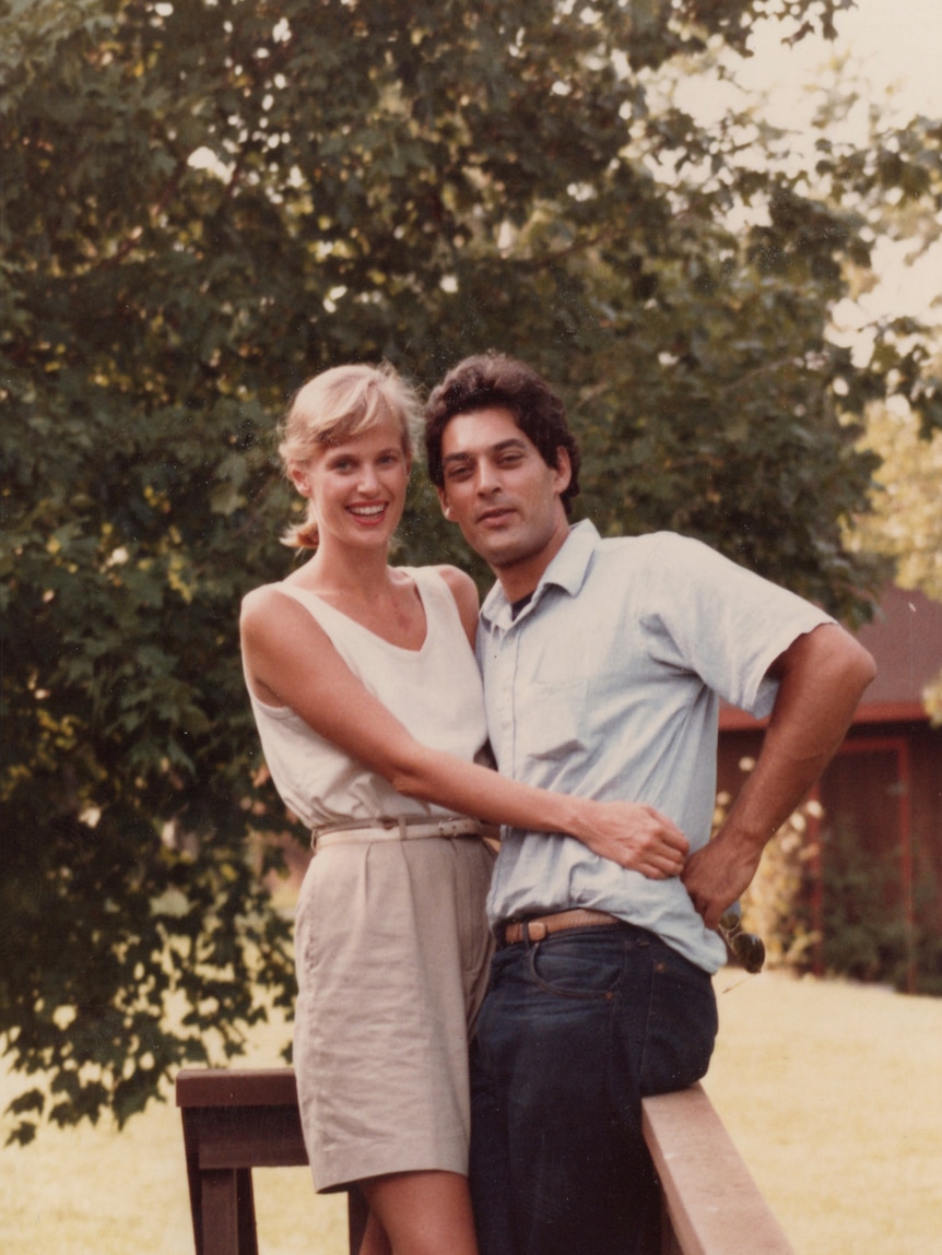 An old photo of a young couple: a blonde woman in a singlet and shorts, and a dark-haired man in a short-sleeved shirt.