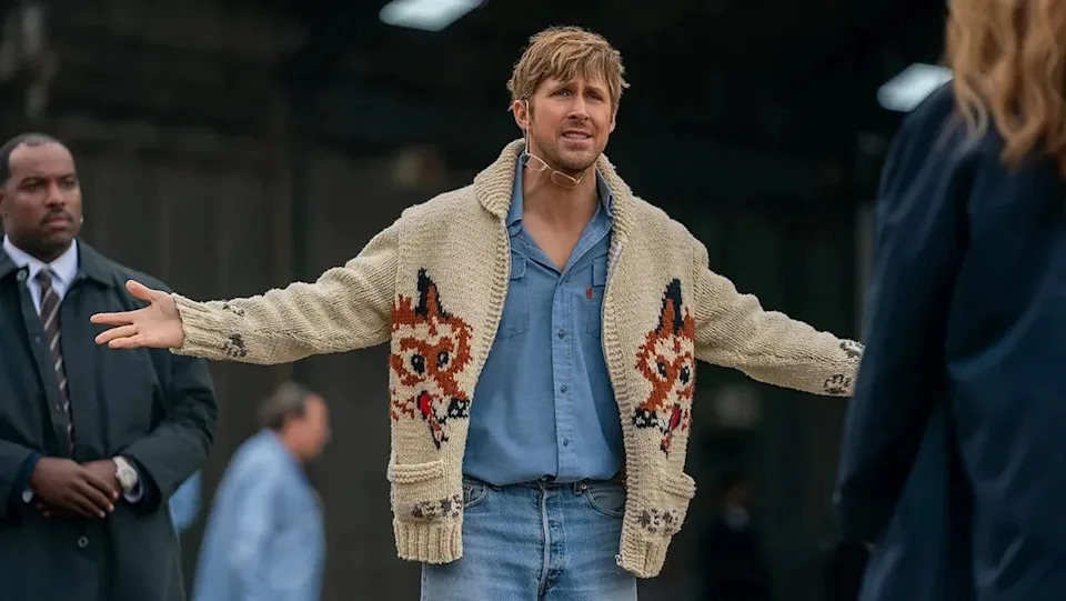 Ryan Gosling in his Fox sweater with his arms out wide in Project Hail Mary
