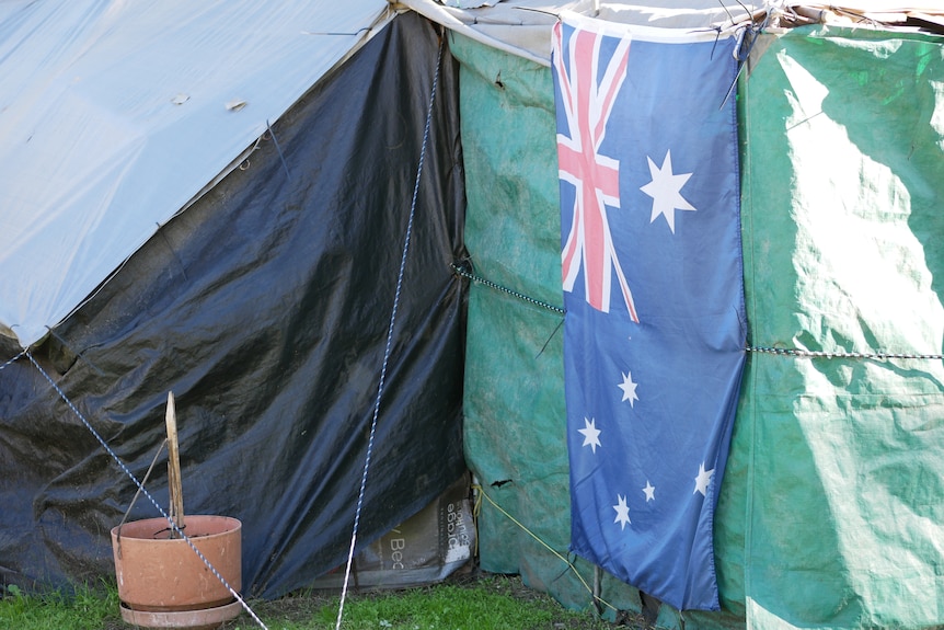 green and black tarps decorated with an australian flag.
