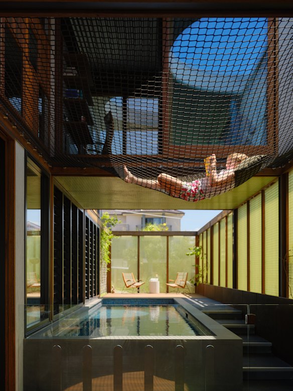 There’s a touch of magic about the pool, thanks to the oculus, which reflects the night sky, and the net, which creates casual seating suspended over the water.