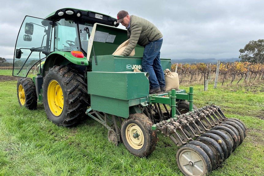 A man on a tractor.