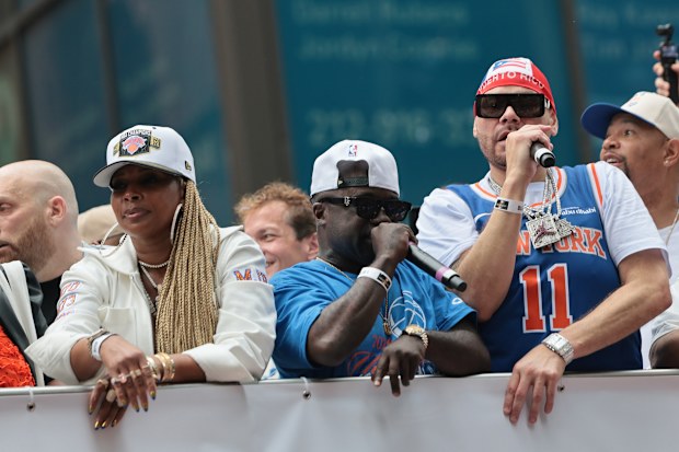 Singer Mary J. Blige, Rapper Havoc, and Rapper Fat Joe ride on a float during the New York Knicks Championship ticker tape parade 