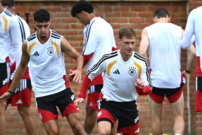 Joshua Kimmich goes through some drills at Germany training