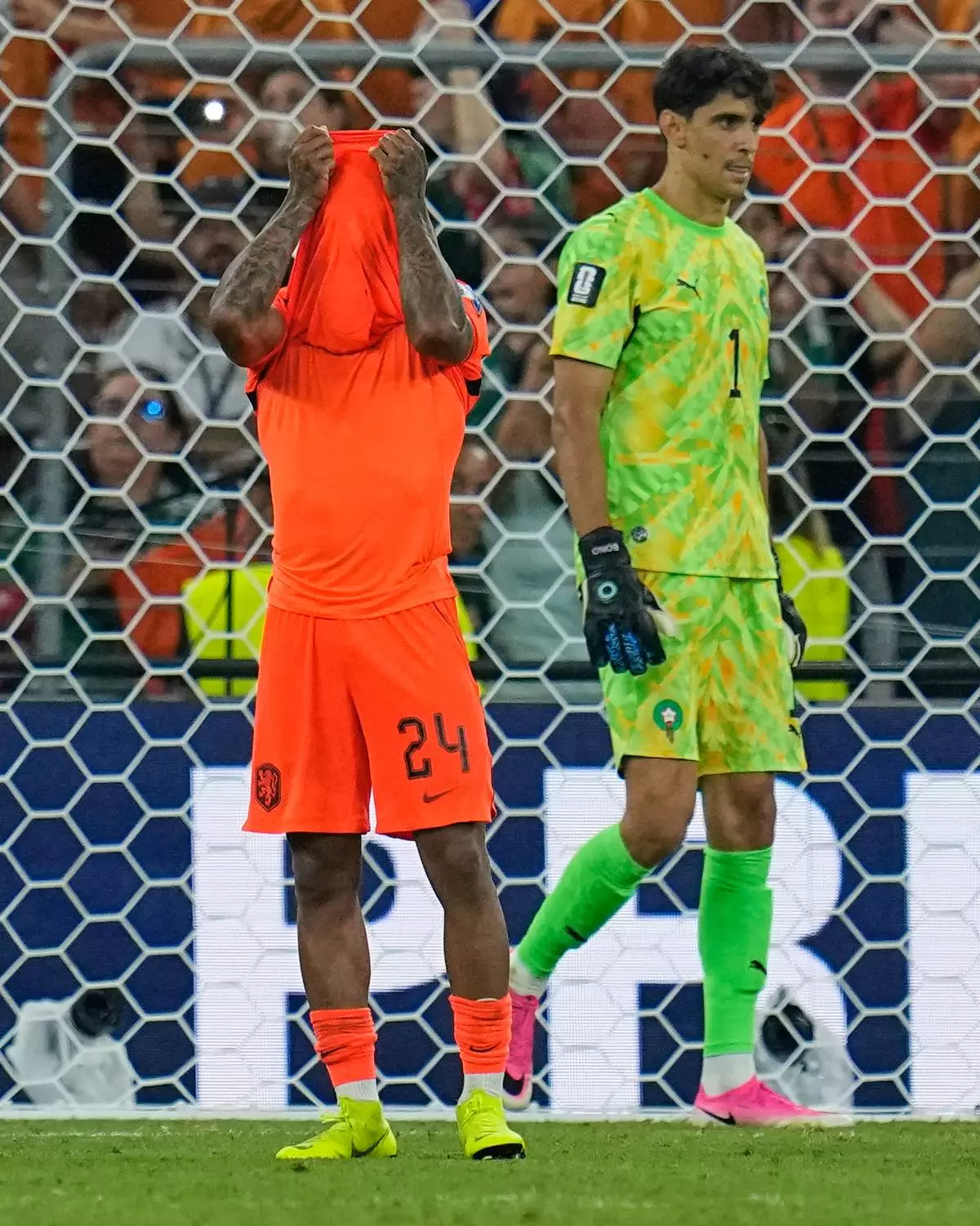 Netherlands' Crysencio Summerville (24) reacts after missing a penalty as Morocco goalkeeper Yassine Bounou (1) walks past during the World Cup round of 32 soccer match between the Netherlands and Morocco in Guadalupe, near Monterrey, Mexico, Monday, June 29, 2026. (AP Photo/Ricardo Mazalan)