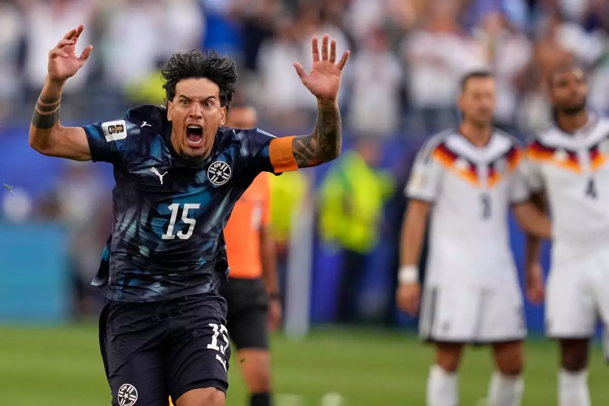 Paraguay's Gustavo Gomez celebrates after winning the World Cup round of 32 soccer match between Germany and Paraguay in Foxborough, Mass., near Boston, Monday, June 29, 2026. (AP Photo/Charles Krupa)