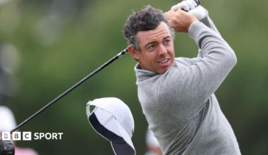 Rory McIlroy's cap flies off on the 13th hole