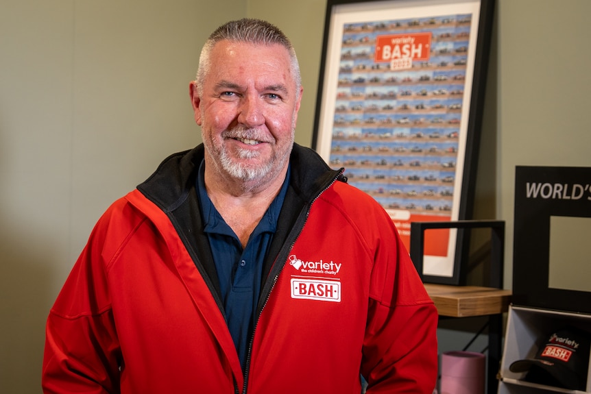 A man wearing a red jacket