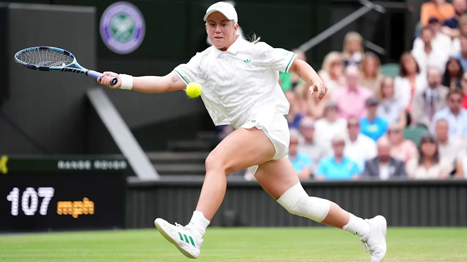 Sonay Kartal hitting a ball at Wimbledon.