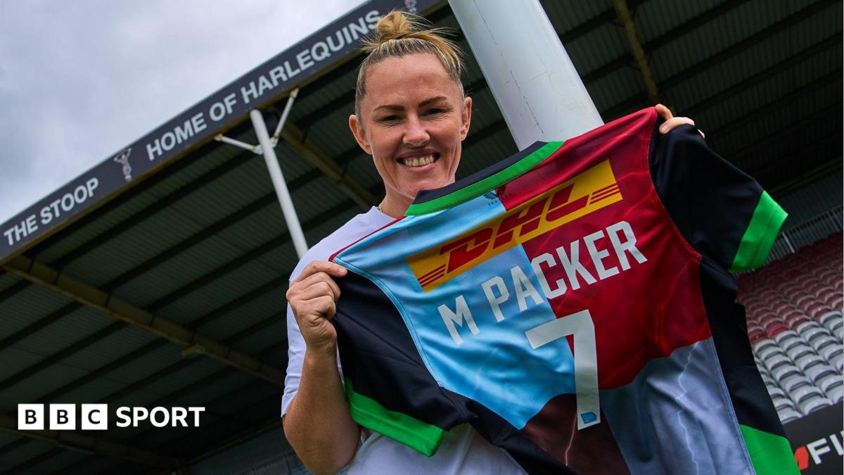 Marlie Packer holds up a Harlequins shirt with her name on it
