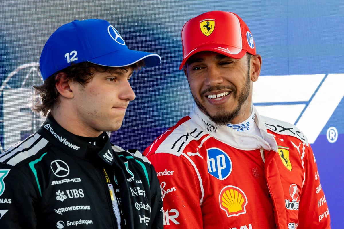 Lewis Hamilton smiles as Kimi Antonelli pouts at the Barcelona GP