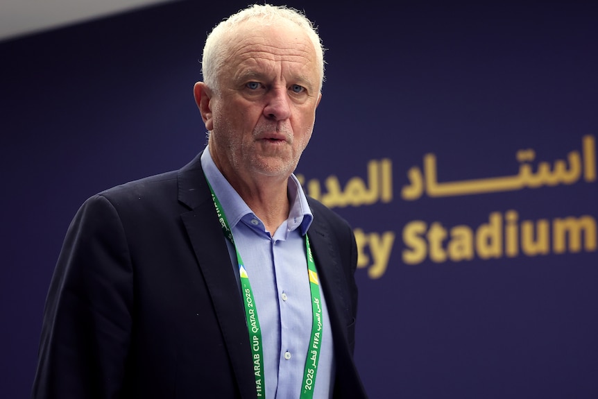 Graham Arnold arrives at a stadium in Qatar as Iraq football coach.