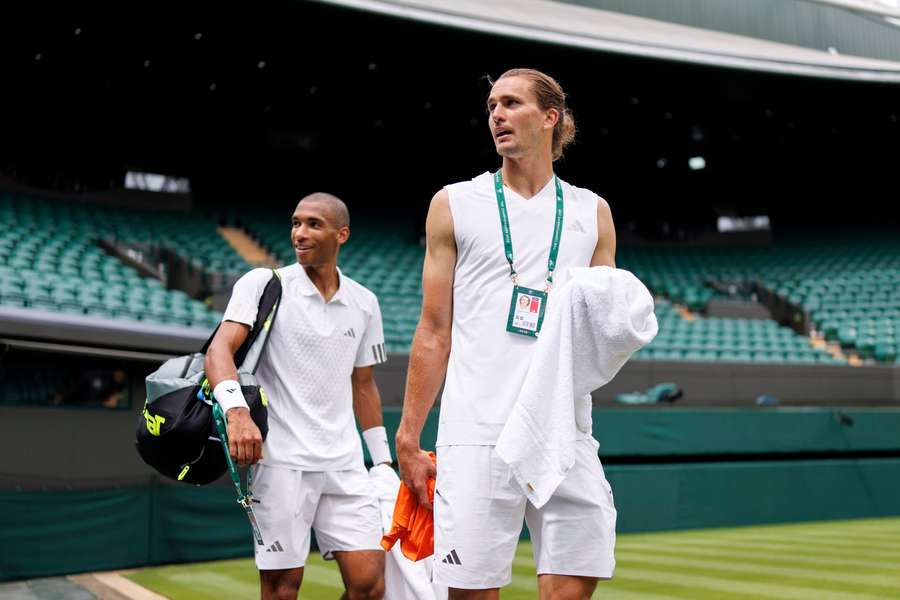 Zverev (R) arrives at Wimbledon a Grand Slam champion