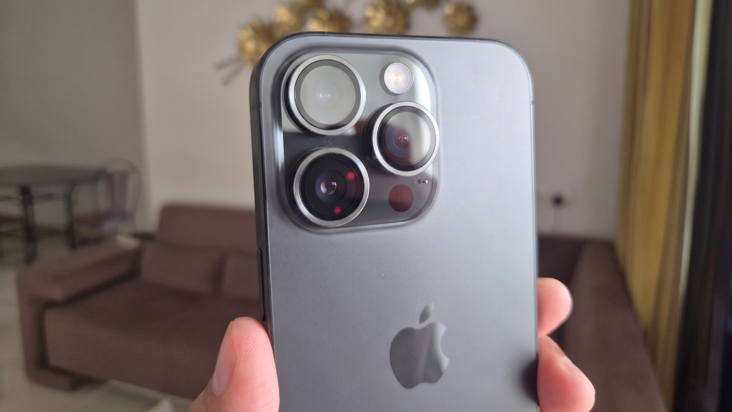 A black iPhone 16 Pro in hand A black iPhone 16 Pro in hand