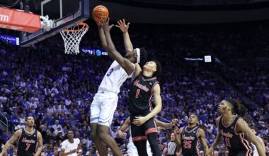 BYU forward AJ Dybantsa (3) goes to the basket against Houston guard Isiah Harwell (1) during an NCAA college basketball game Saturday, Feb. 7, 2026, in Provo, Utah. (AP File Photo/Rob Gray)