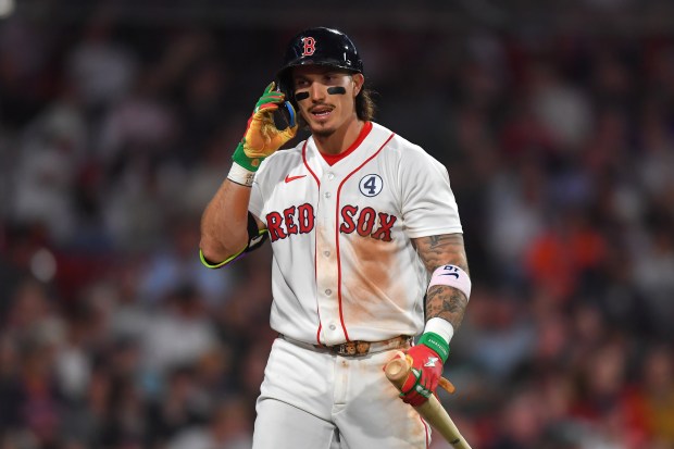 Boston Red Sox's Jarren Duran returns to the dugout after he struck out swinging in the eighth inning of a baseball game against the Baltimore Orioles, Tuesday, June 2, 2026, in Boston. (AP Photo/Steven Senne)