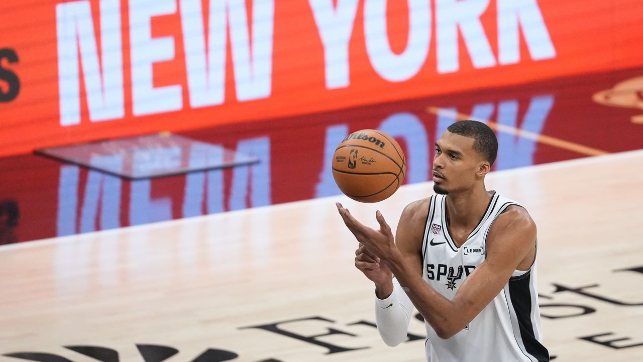 San Antonio Spurs forward Victor Wembanyama shoots a free throw during the first half of Game 2 of the NBA Finals basketball series against the New York Knicks, Friday, June 5, 2026, in San Antonio. (AP Photo/Eric Gay)